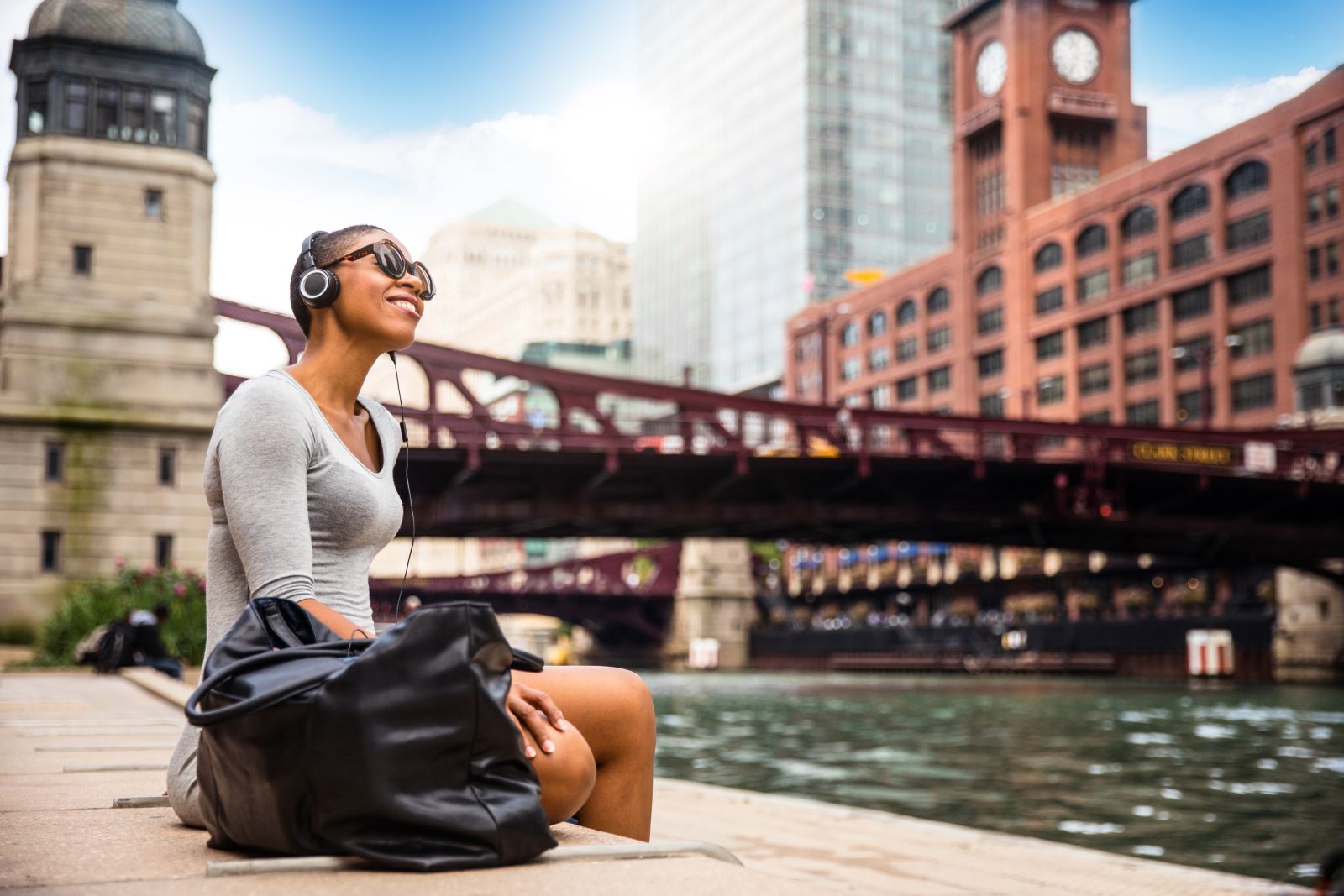 woman sitting near bridge in Chicago