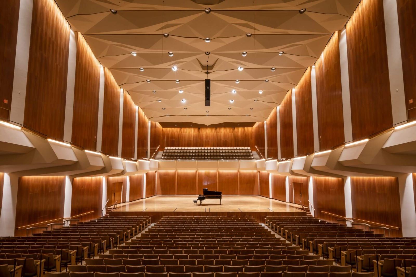 piano on stage in well-lit empty auditorium of Krannert Center